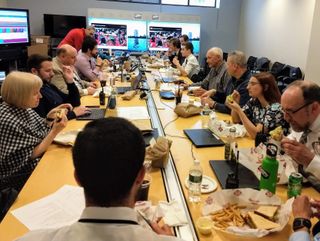 The LETS team, contractors, and students take a rare chance to eat together in the Commencement Command Center where the team coordinates support and streaming of numerous ceremonies, including BU’s main Commencement.