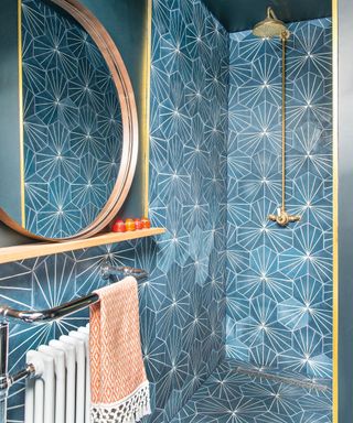 Blue tiled shower room showing painted bathroom tiles