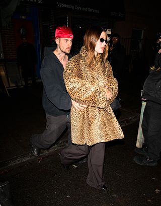 Justin and Hailey Bieber, along with Kendall Jenner, have a fashionable outing at Lucali in New York for a pizza night. The trio turns heads as they step out for the casual yet stylish dinner.