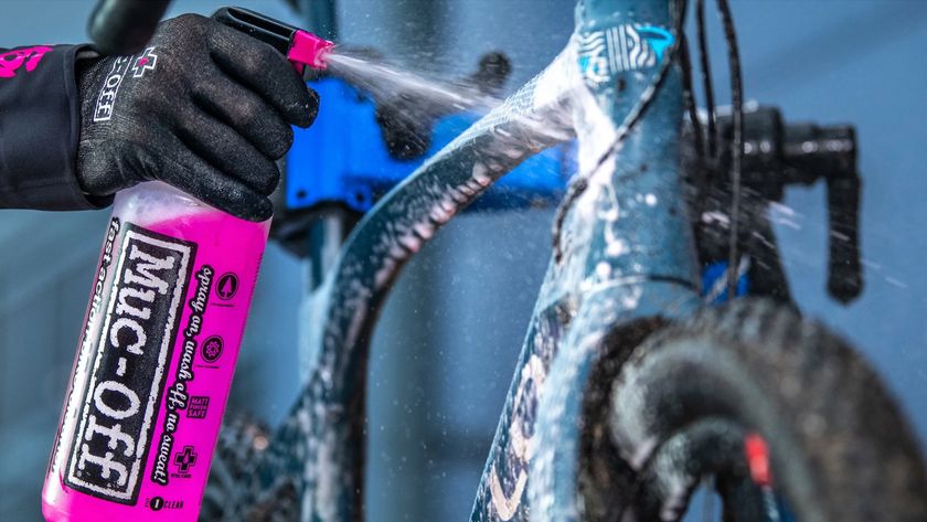 Bike being sprayed with Muc-Off cleaner