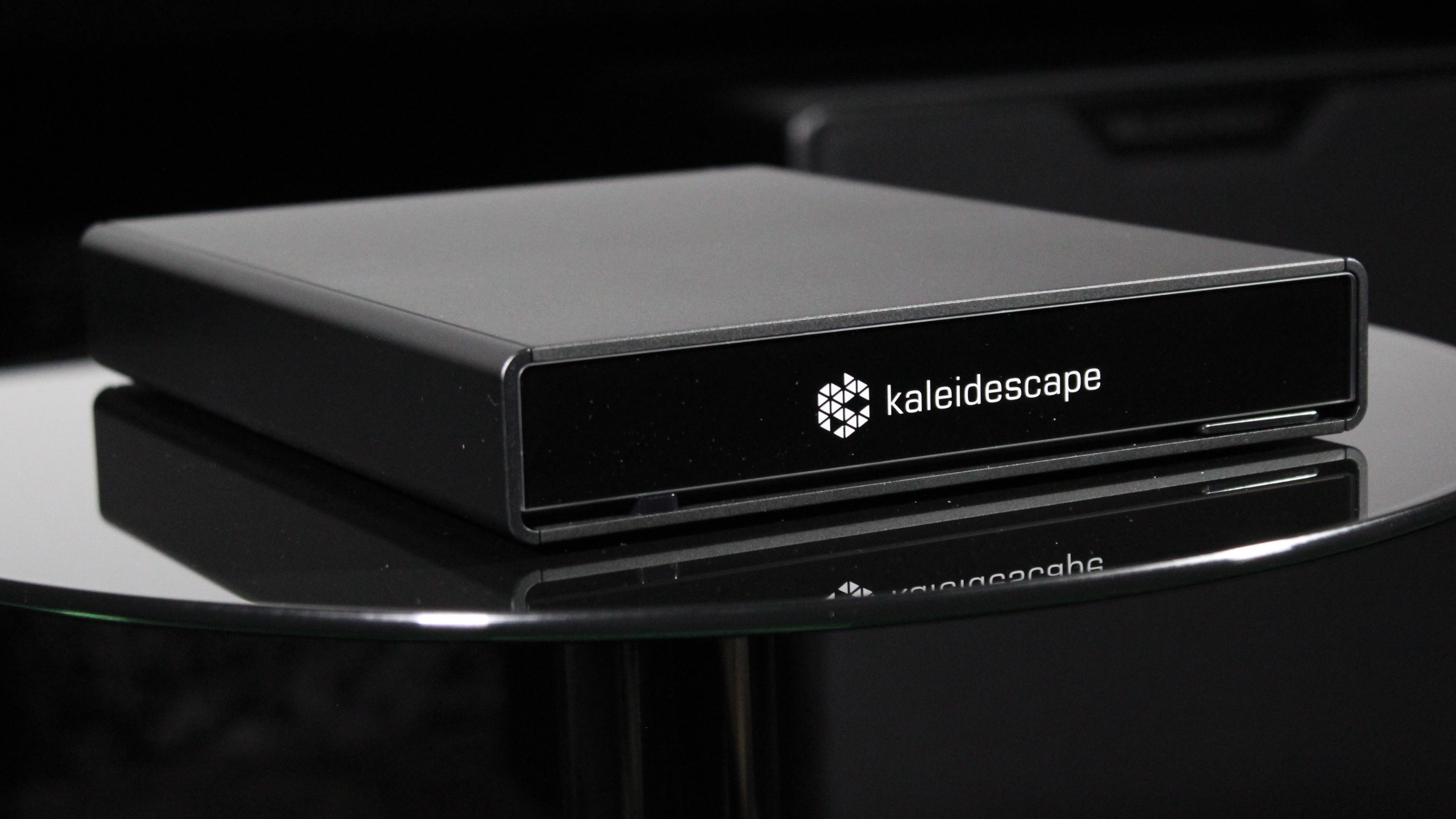 Kaleidescape Strato V on glass table