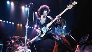 JUNE 22: WEMBLEY EMPIRE POOL Photo of THIN LIZZY and Phil LYNOTT and Scott GORHAM, L-R: Phil Lynott (wearing leather trousers), Scott Gorham performing live onstage