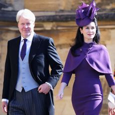 Charles Spencer, 9th Earl Spencer and Karen Spencer arrive at the wedding of Prince Harry to Ms Meghan Markle at St George's Chapel, Windsor Castle on May 19, 2018 in Windsor, England.