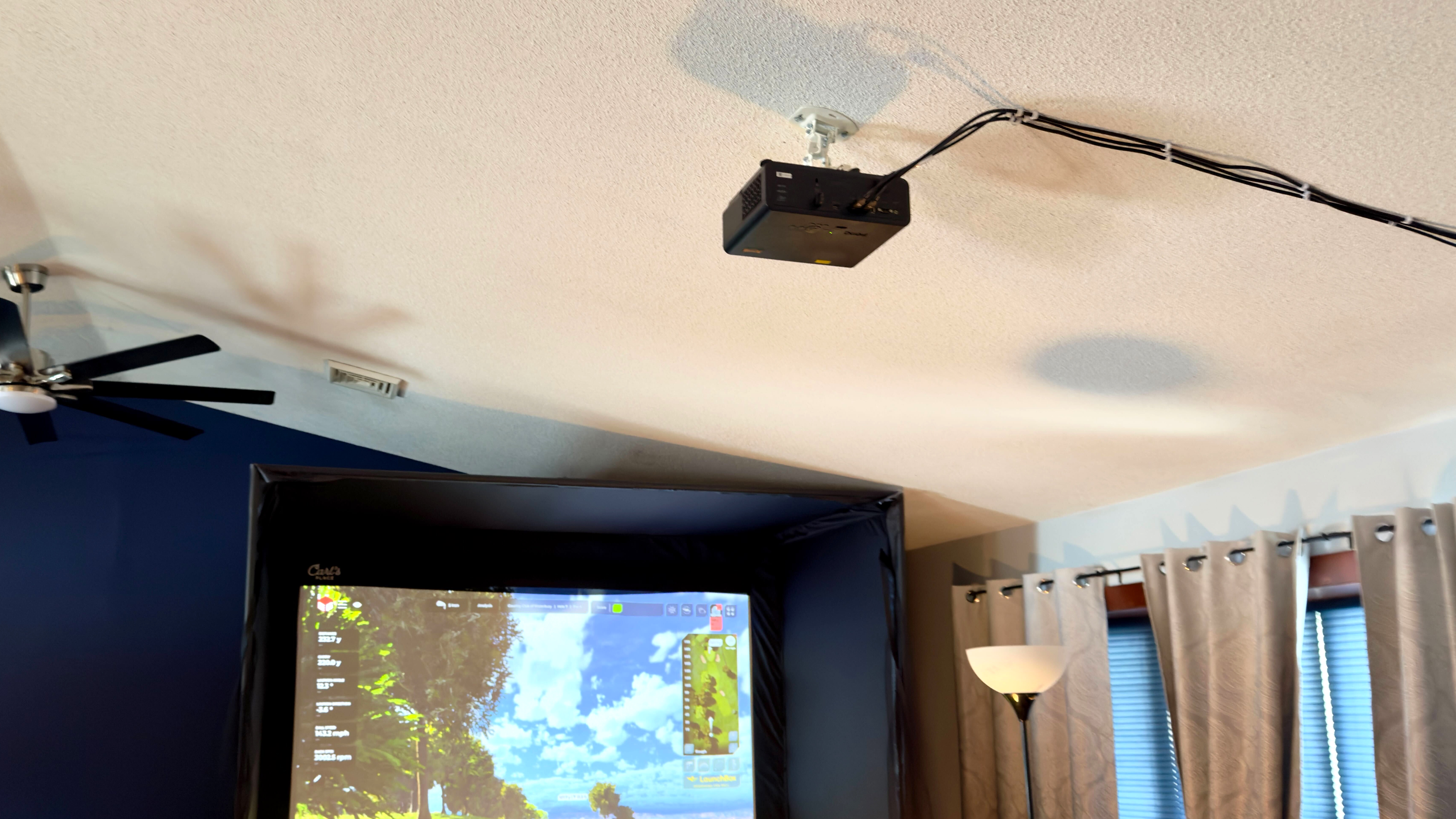 BenQ projector mounted on a ceiling