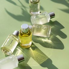 a picture of perfumes on a green background - pistachio perfume