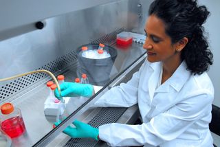 Mona Jhaveri performing cell culture techniques at Foligo's facility in Rockville, Md.