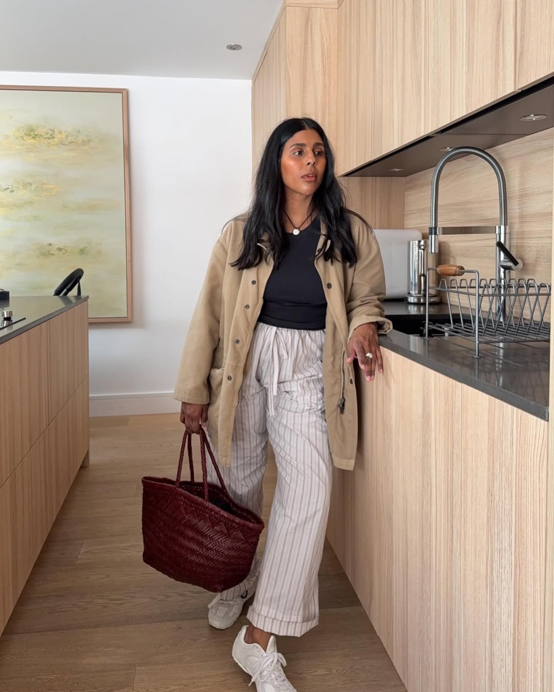 Elegant airplane outfits: striped trousers and barn jacket