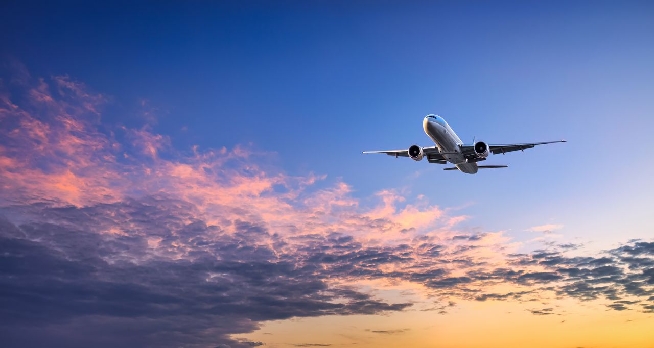 Airplane flying in the sky and beautiful sky clouds