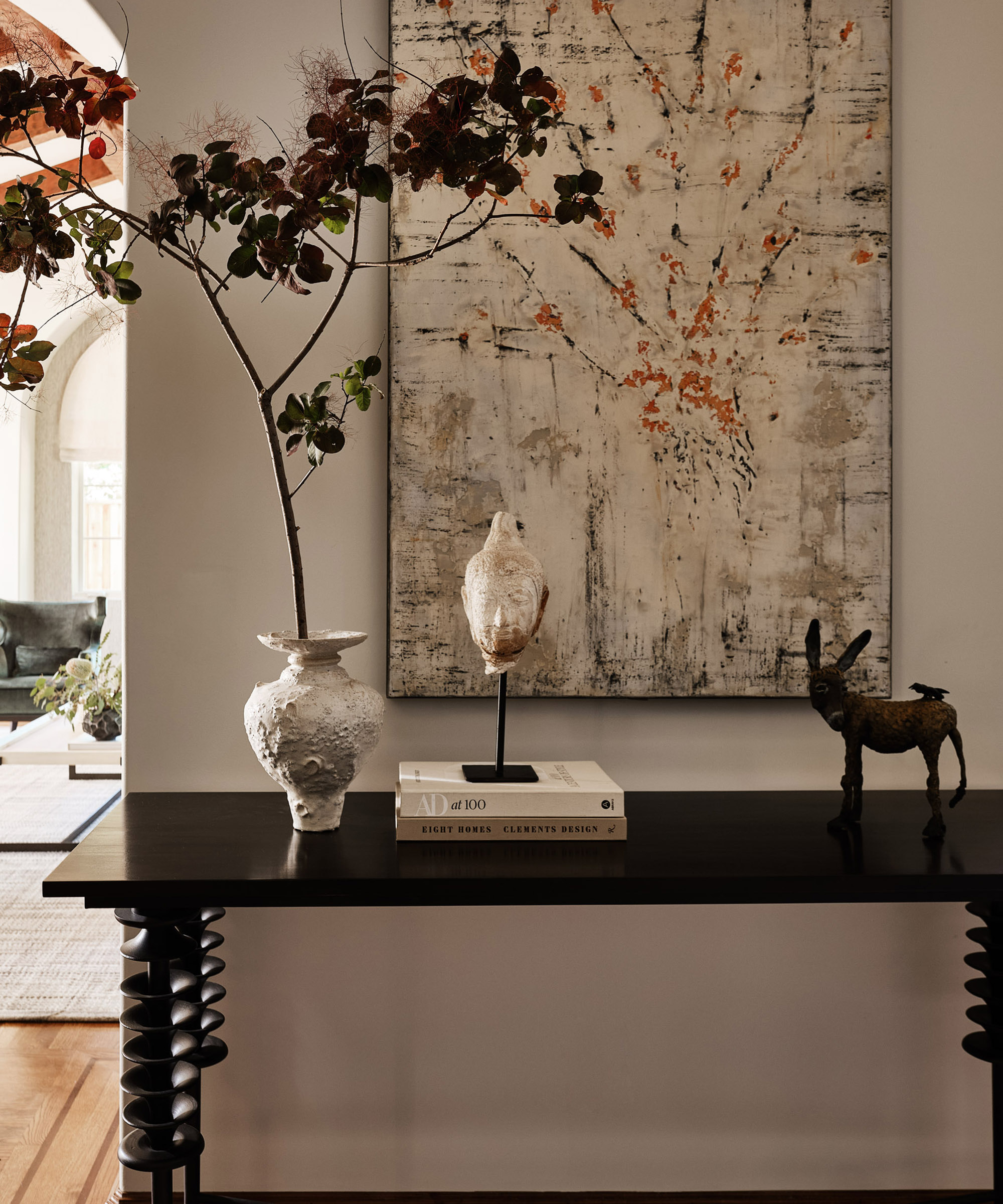 black console table with vases on it