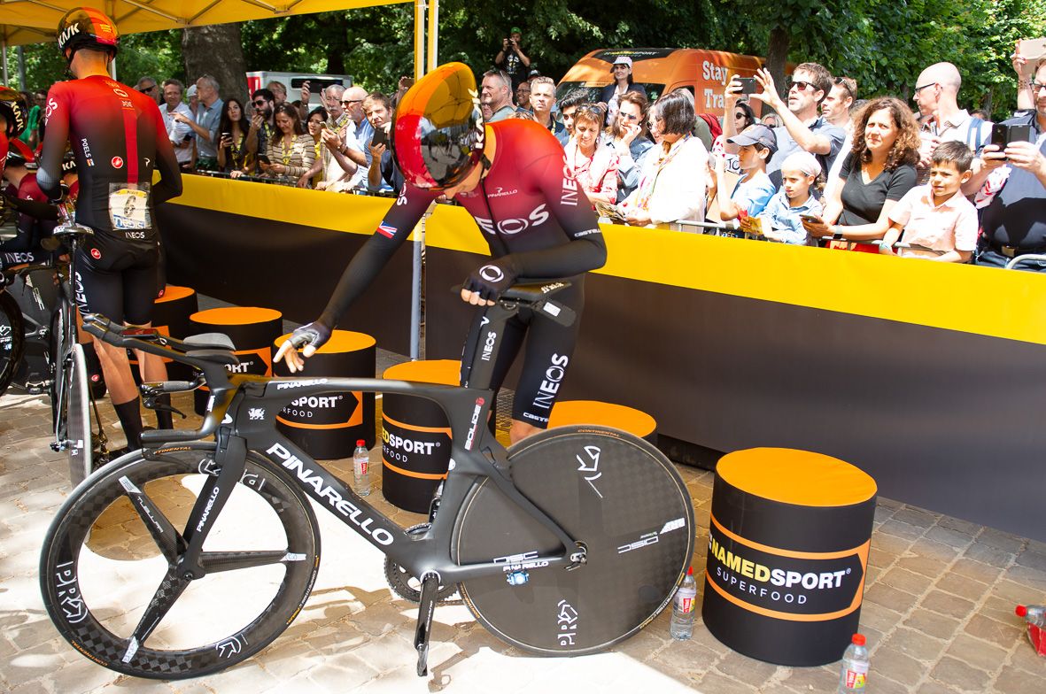 Geraint Thomas checks over his Pinarello Bolide ahead of the stage start