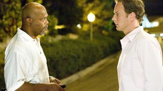 Samuel L. Jackson and Patrick Wilson stand in a quiet neighborhood in Lakeview Terrace
