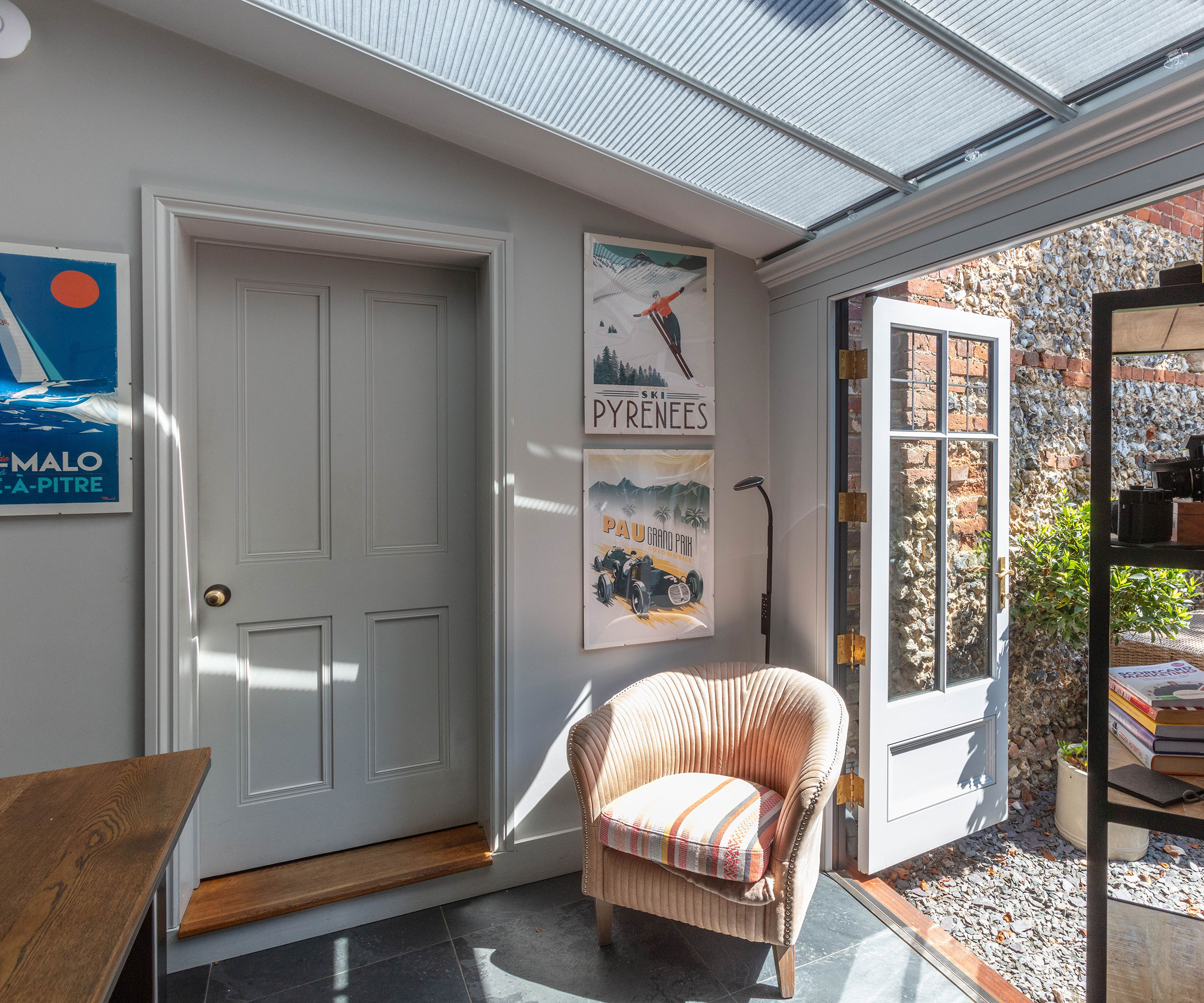 small conservatory with French doors and slate flooring
