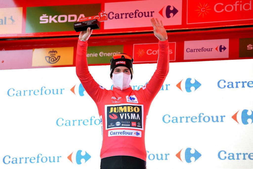 VINUESA SPAIN OCTOBER 22 Podium Primoz Roglic of Slovenia and Team Jumbo Visma Red Leader Jersey Celebration Trophy Mask Covid safety measures during the 75th Tour of Spain 2020 Stage 3 a 1661km stage from Lodosa to La Laguna Negra Vinuesa 1735m lavuelta LaVuelta20 La Vuelta on October 22 2020 in Vinuesa Spain Photo by Justin SetterfieldGetty Images