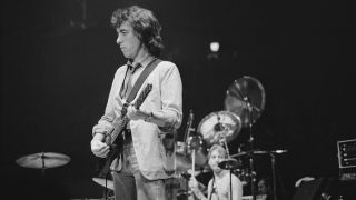 Bill Wyman, playing a Steinberger custom short-scale XL bass, at the Ronnie Lane ARMS Benefit Concert at Madison Square Garden in New York City, New York, 8th December 1983.