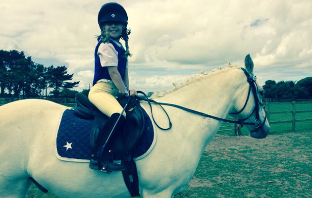 Lucy, aged 9 with her pony Alfie competing last summer.