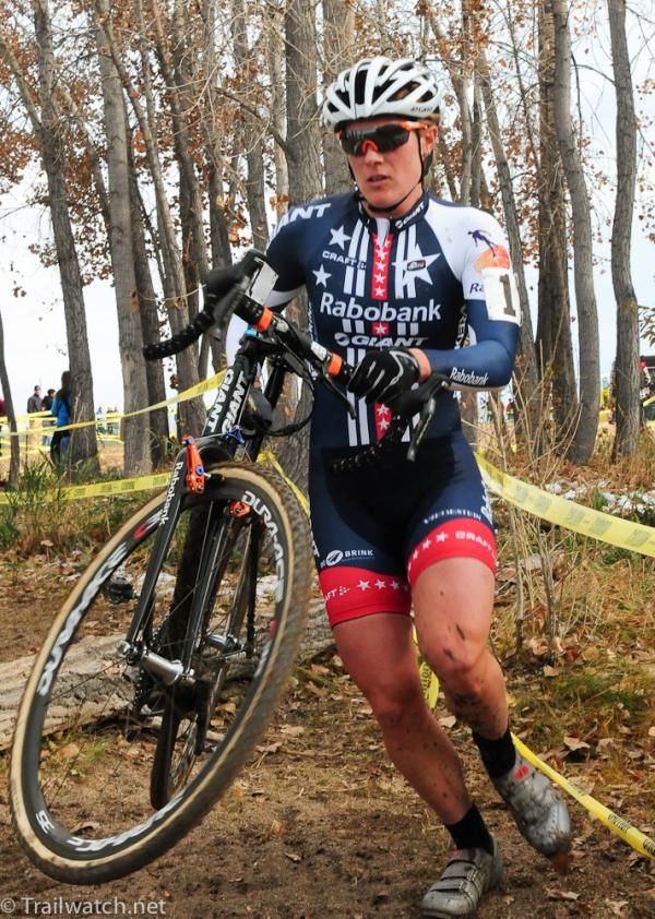 Katie Compton (Rabobank-Giant) running over a log in the woods