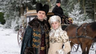 Nicholas Hoult and Elle Fanning standing together in Season 3 of The Great.