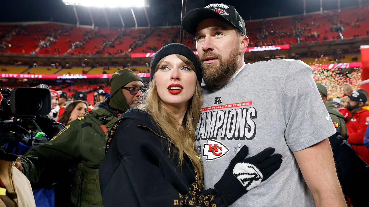 Taylor Swift celebrates with Travis Kelce #87 of the Kansas City Chiefs after defeating the Buffalo Bills 32-29 in the AFC Championship Game at GEHA Field at Arrowhead Stadium on January 26, 2025 in Kansas City, Missouri