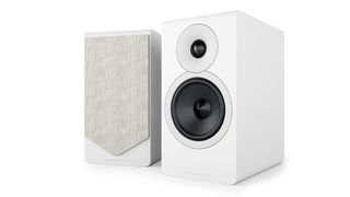 A pair of white bookshelf speakers on a white background