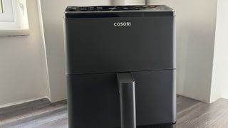 cosori dual blaze air fryer on the counter top