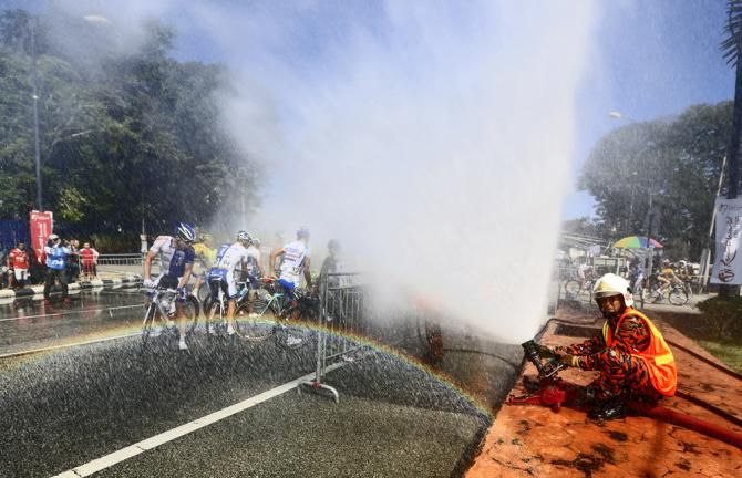 Riders seek relief from the heat after stage 7 at the Tour de Langkawi