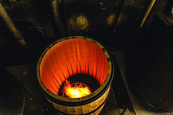 A-Silver-Oak-barrel-being-toasted-over-a-fire-set-into-the-ground.-Credit-Damion-I.-Hamilton.jpg