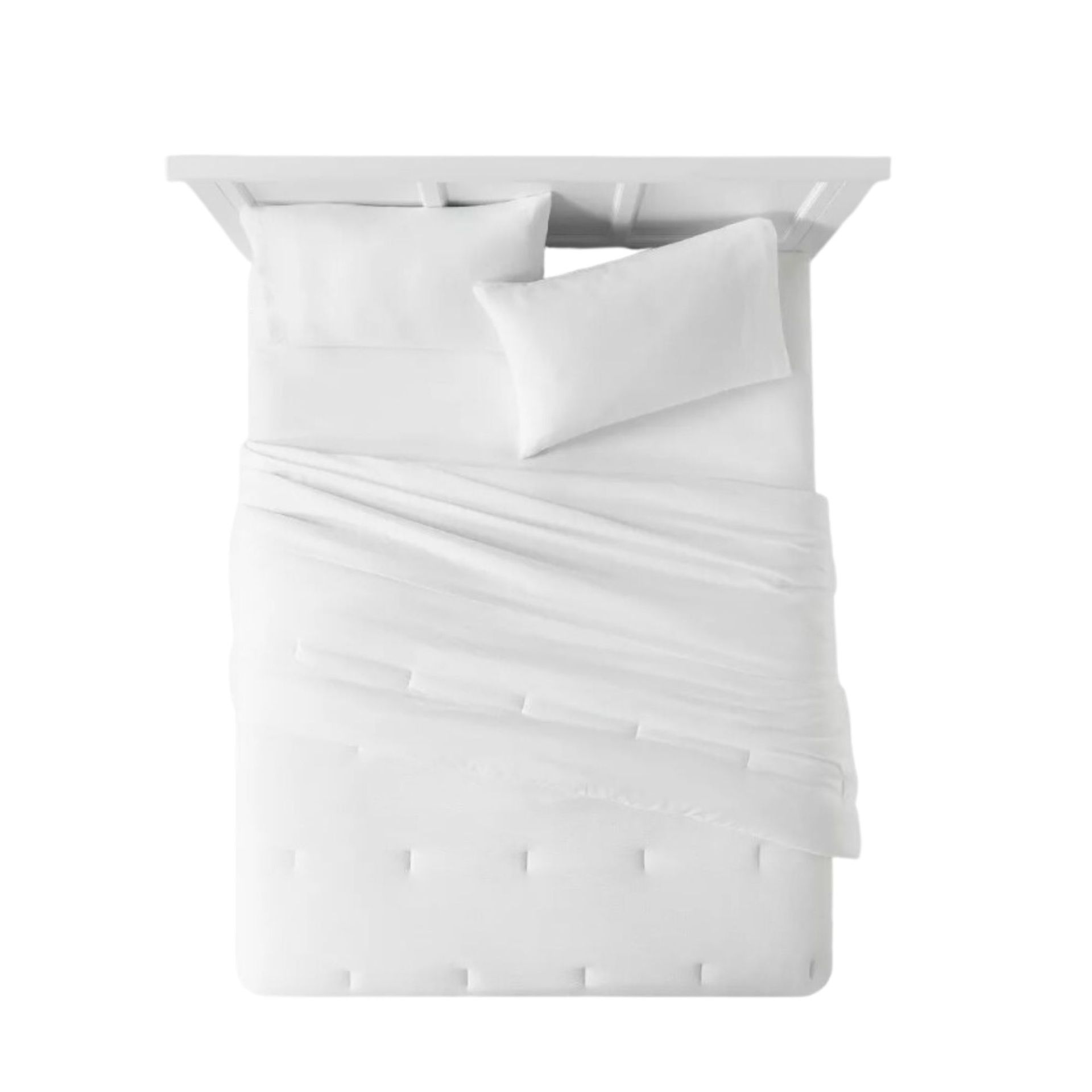 Selimut di tempat tidur putih