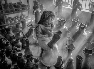 Girl working on pottery