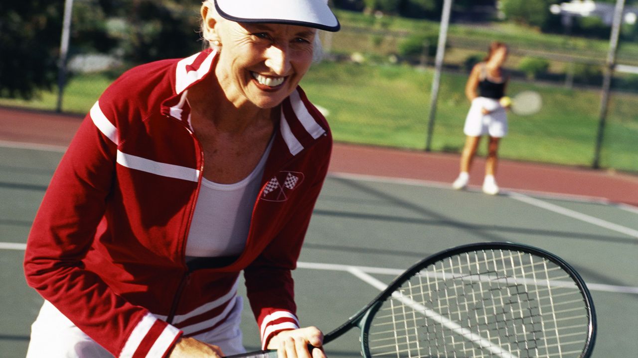 Older woman playing tennis