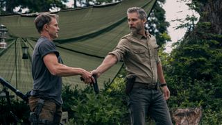 Kyle and Shane hold a gun in Untamed