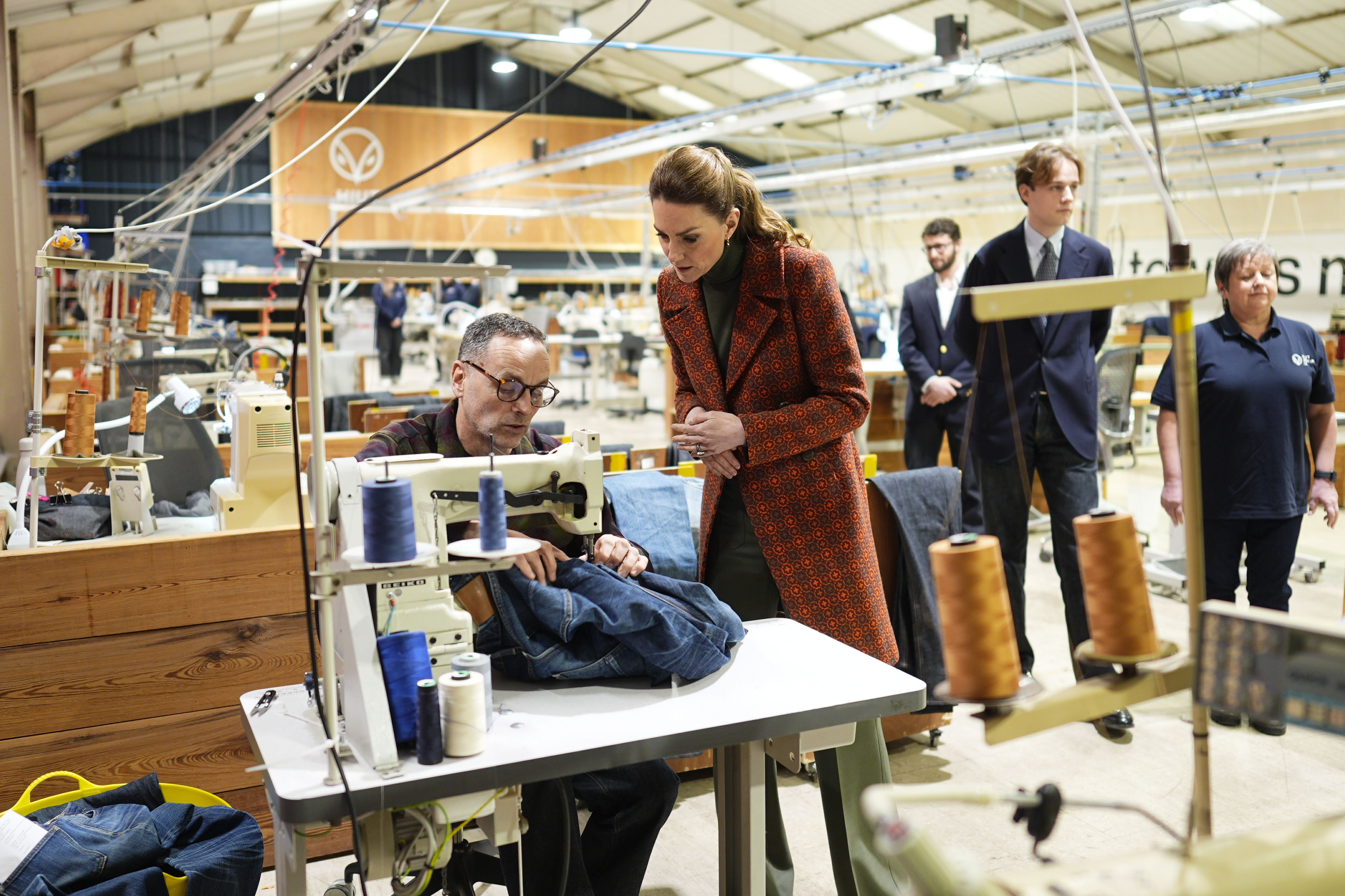 The Princess of Wales as a pair of jeans are repaired during a visit to Hiut Denim, a family-owned company based in Cardigan, designing and manufacturing premium jeans entirely in the UK.