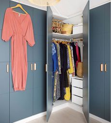 dressing room with blue fitted wardrobes