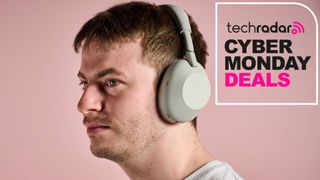 Man wearing Sony WH-1000XM6 with words 'TechRadar: Cyber Monday deals'