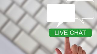 Live chat substance   successful  greenish  with a digit  pointing to it and a keyboard successful  the inheritance  blurred