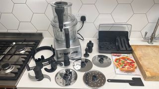 The Magimix 4200XL on a kitchen countertop with all its accessories