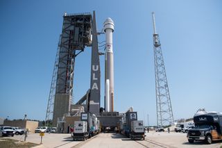 Boeing's Starliner spacecraft and its Atlas V rocket roll to the launch pad.