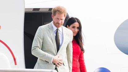 Prince Harry & Meghan Markle Leaving Plane