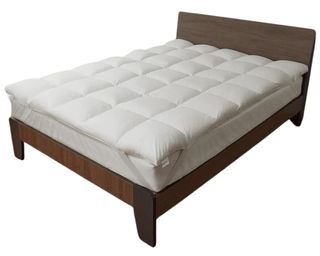 Coop Retreat Mattress Topper on dark brown wooden bed frame