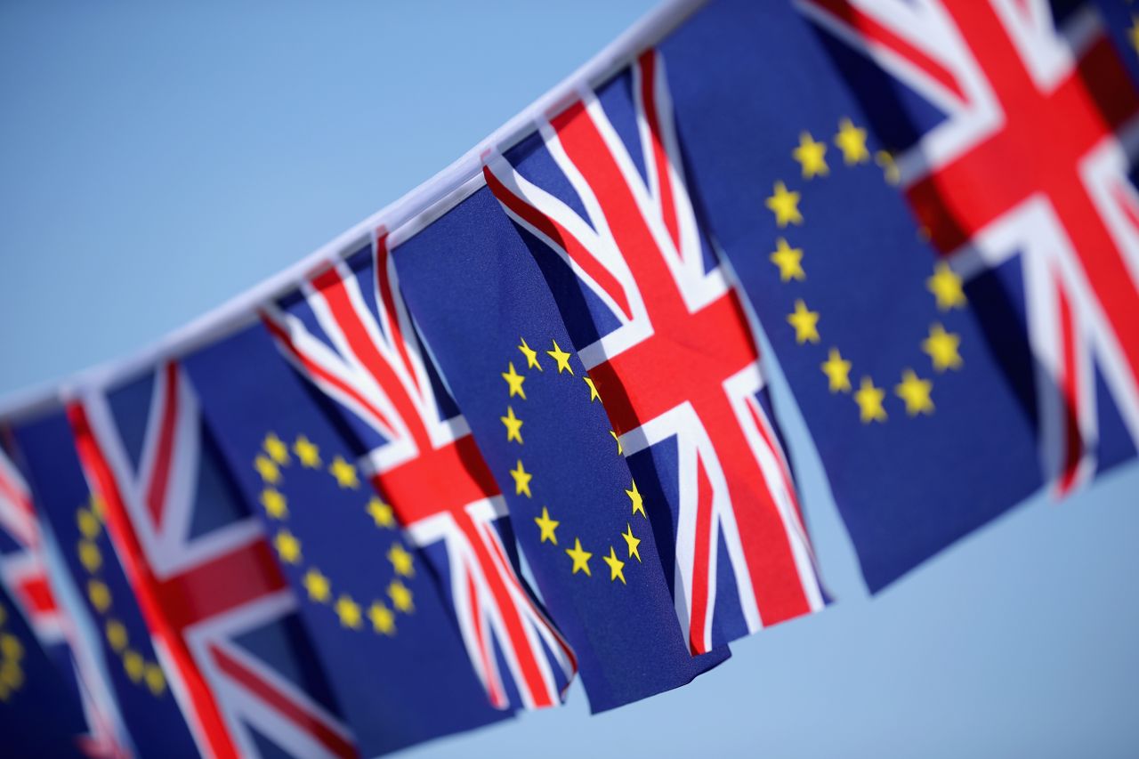 EU flags fly next to UK flags