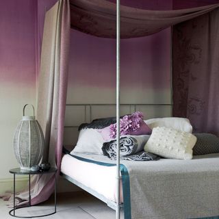 muted damson and grey four poster bed
