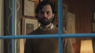 Penn Badgley eerily stares out of his study window in You: Season 4 Part 1.