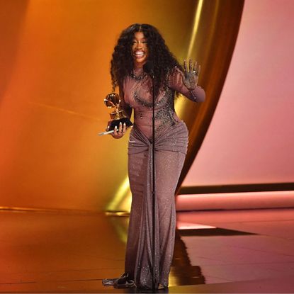 SZA on stage at the 66th Grammy Awards in 2024 after her win