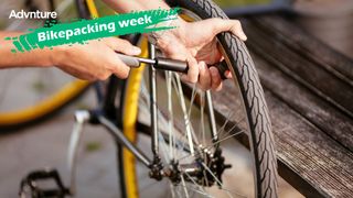 Person pumping up bike tire