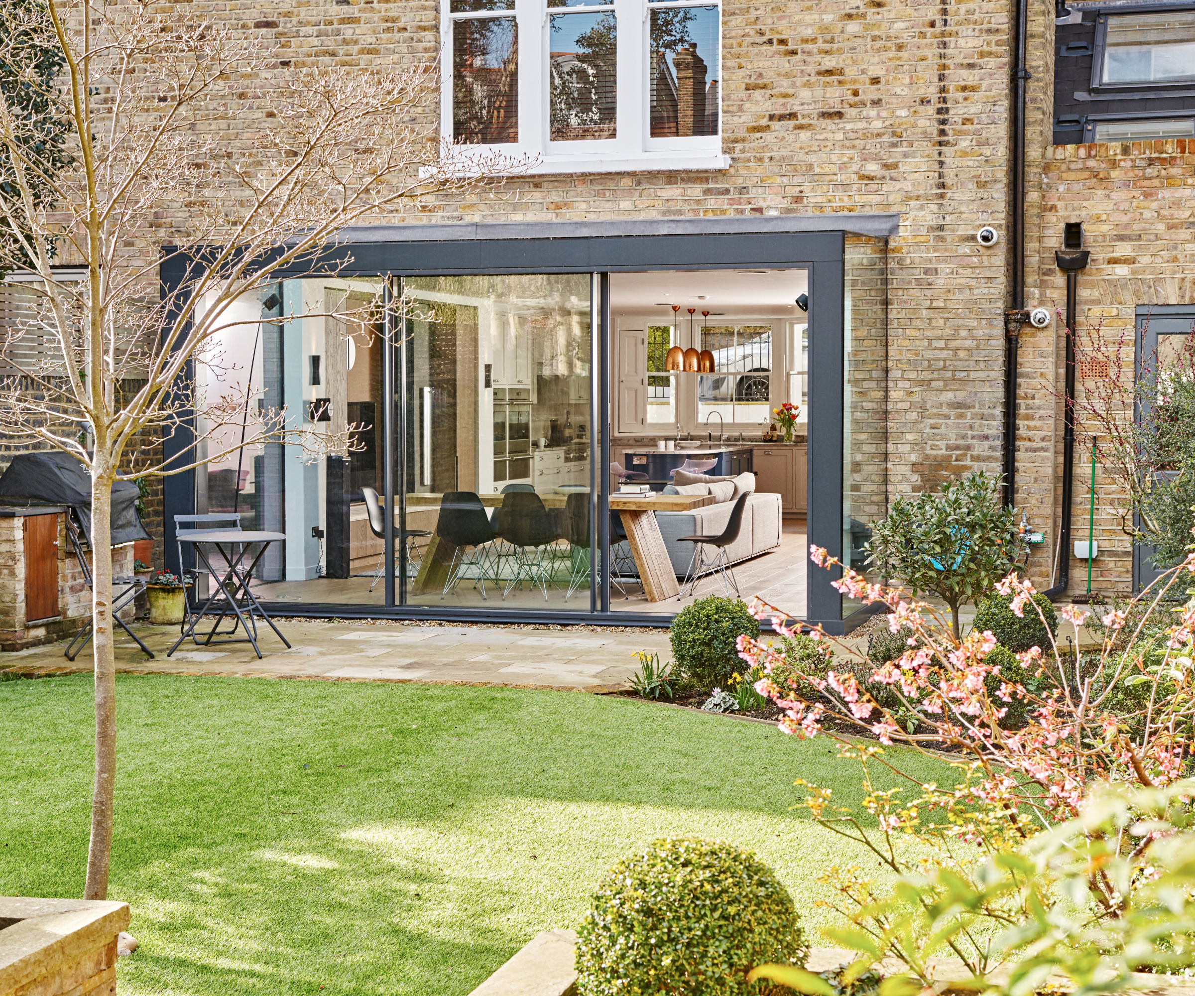 small glass kitchen extension on rear of home