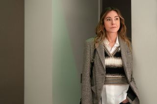 Christa Miller as Liz, leaning against a wall, in 'Shrinking'