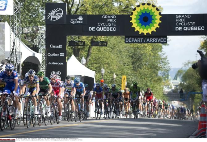 The bunch passes through the start/finish line