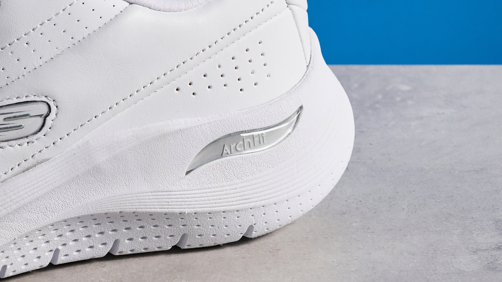 Skechers Arch Fit 2.0 Star Bound photographed in front of a blue background.