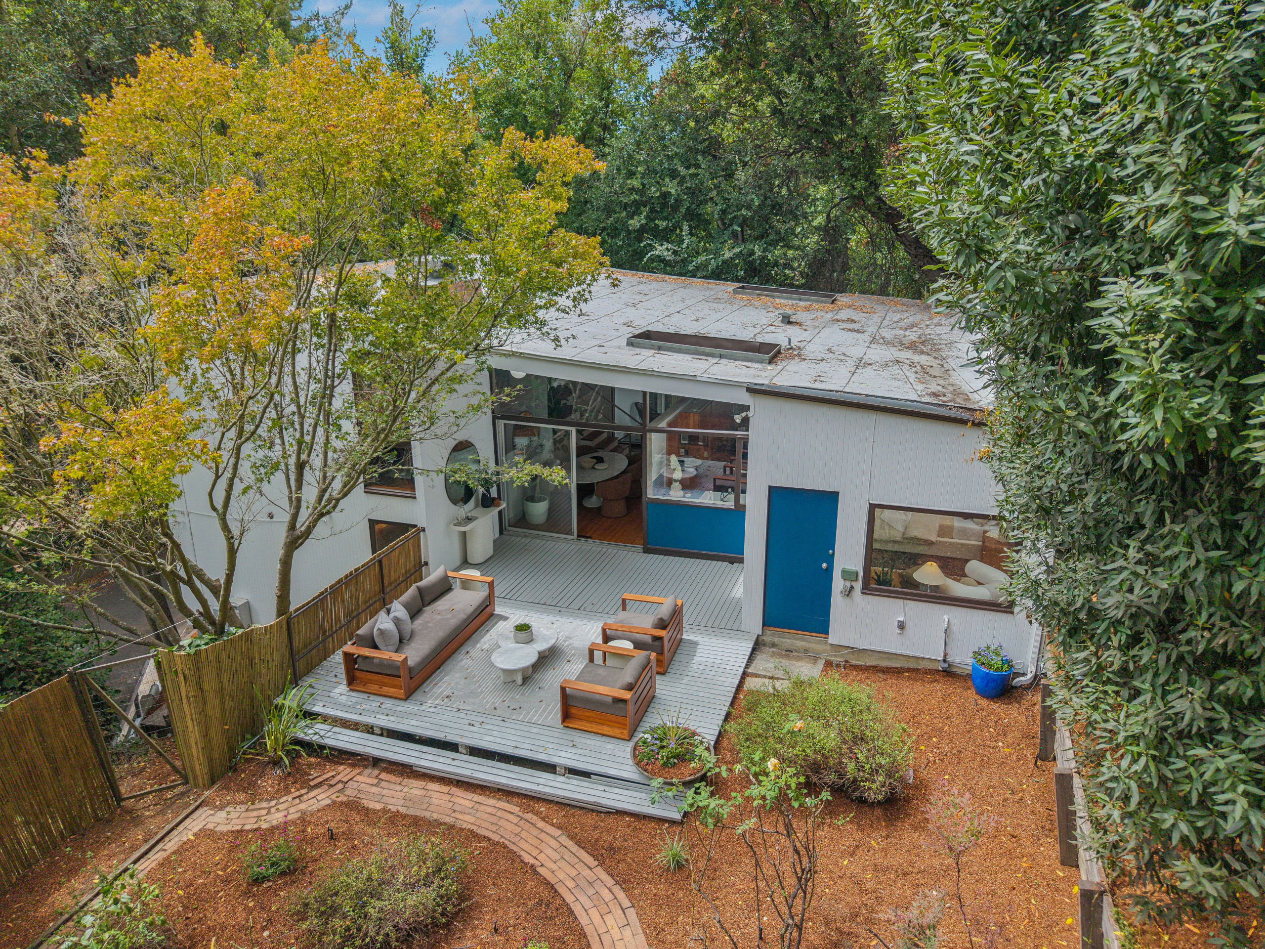 The upper floor has direct access to the deck and the yard