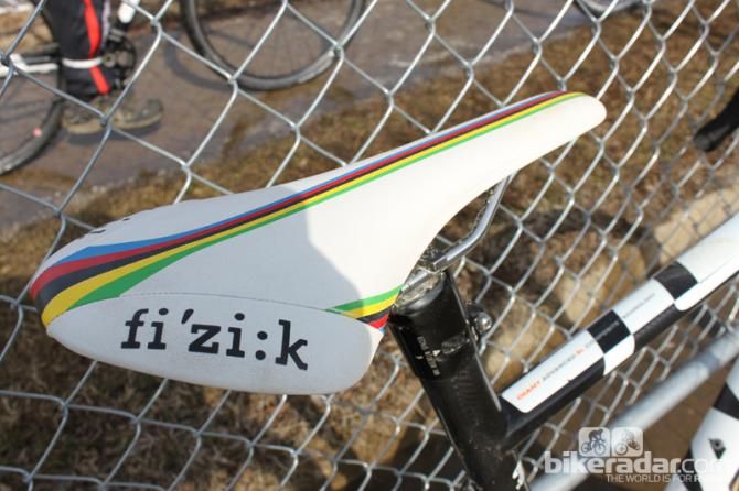 Hard-earned world champ colors adorn her fi'zi:k saddle