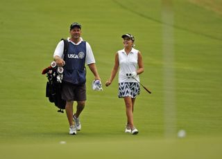 Lexi Thompson walks with her caddie at the US Open